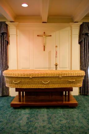 A wicker casket on display in a viewing room at M. John Scanlan Funeral Home in Pompton Plains, NJ.