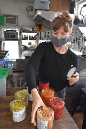 Tara Whitsitt displays a selection of her homemade ferments.