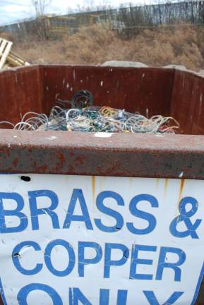 Trash lights 1000 houses Brass and copper are so valuable that a security camera monitors this bin.