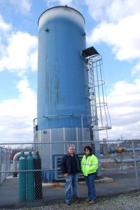 Trash lights 1000 houses Reenee Casapulla and Tom Varro in front of the $1 million flare that burned off methane before the landfill-to-energy plant.