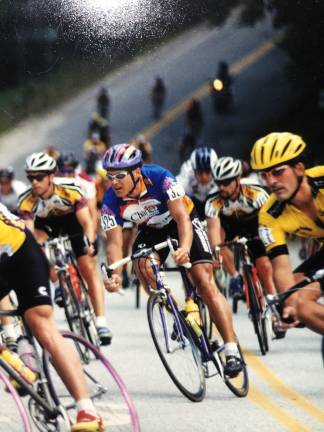 On three wheels, chasing freedom Quinn (center), 36, competing in the 5-day Killington Stage Race in 1997 in Vermont.