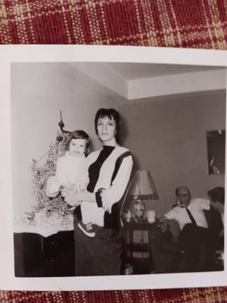 The writer and her mom, age 18, with Grandpa in the background.