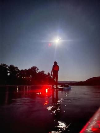 An electric light parade on the Delaware Joe Gara paddleboarding the Delaware on his first Full Moon Float in August.