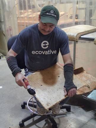 Dan Binetti, of Mechanicville NY, making chairbacks from a hemp-mycelium composite.