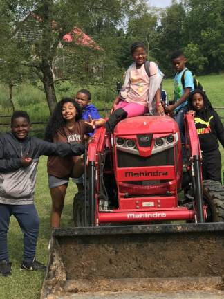 Campers visiting Freedom Farm last July from Camp Deerpark, a Mennonite-owned retreat center.