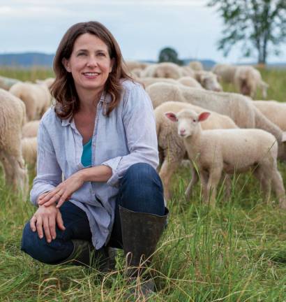 Kimball and her flock of sheep, which began as her pet project and has grown into a major part of Essex Farm's business model.