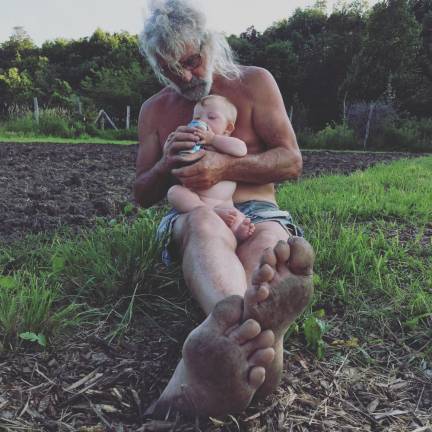 Zeke kicking back on the farm with his dad, Bill Becker.