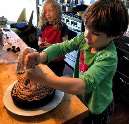 Making a cake can become its own reason for celebration. When it was done, this cake looked like a robin’s nest, complete with blue eggs.