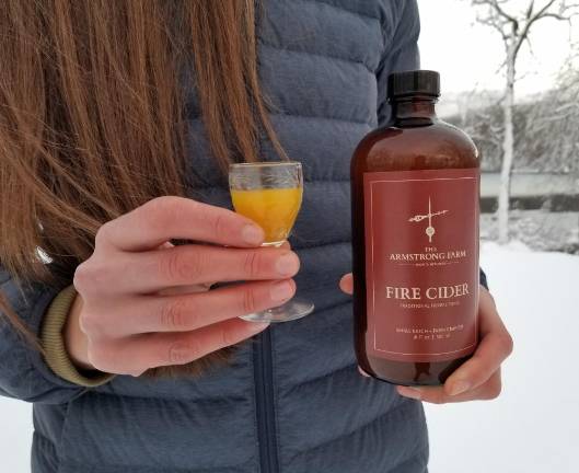 Sarah Berman with a shot of her homemade folk remedy, which she is now free to call fire cider.