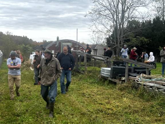 Farmer and writer Keith Stewart shows a group of veterans around his Greenville, NY organic farm in October as part of an Armed to Farm field trip.