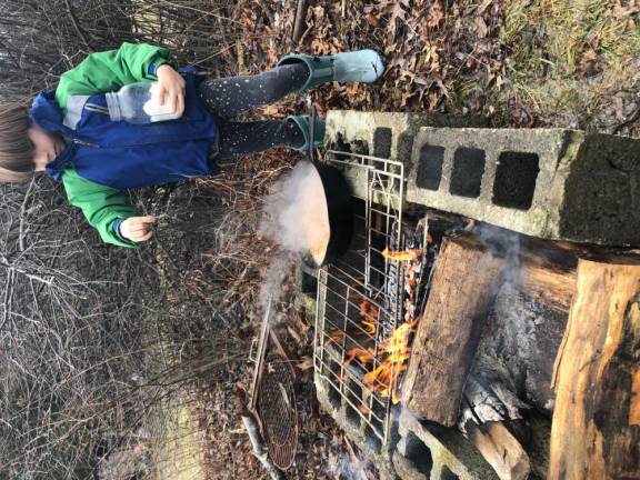 Cooking over a cinderblock rectangle gives great control.