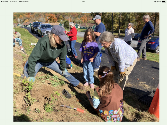 Turning lawns into lifelines Sally Greco (left) and Dr. Anne Wibiralske work with kids installing a pollinator garden at Mountain Lake Park in Warwick, NY.