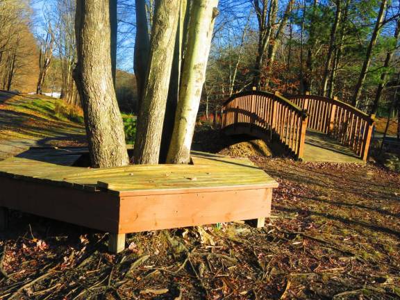 Benched Tree benches and decorative bridge along O&W rail trail, Mountain Dale to Woodridge section (Photo by Pamela Chergotis)