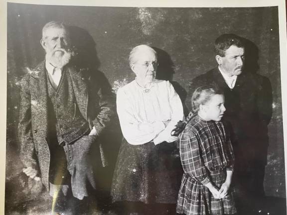 An old photo of John DeBaun, left, whose right arm was disabled by polio.