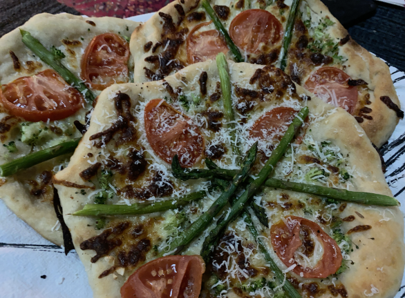 A rustic pizza that bubbles With yeast and flour on the shelves and 2020 in the rearview, let’s party.