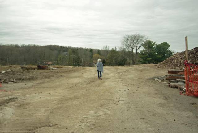 Ann Gifford, a member of the Millbrook Community Partnership, wanders the grounds.