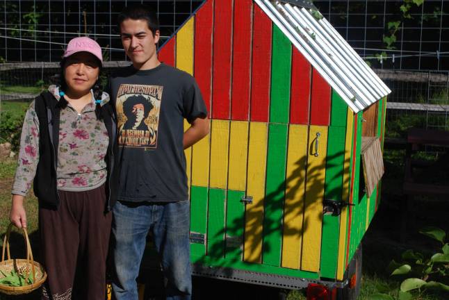 Coop dreams Raphael Cox, 18, and his mom, Nancy Peng, in 2013 in front of the empty chicken tractor that Cox and a friend made. They had to give their hens away after a neighbor complained.