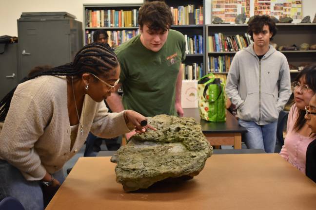 Cracking open deep time Brianna Reid, 30, of Middletown, a natural science and math major at SUNY Orange, and Gavin Gartocki, 19, of Pine Bush, examine the Big One.