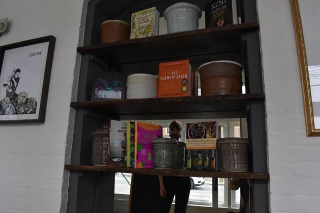 Displayed on the new shelves are the books Whitsitt considers the fermentation canon, along with kimchi crocks made by a New Jersey woman. Eventually she plans to display kojiban, or wooden fermentation tanks, made by Quercus Cooperage in upstate New York.
