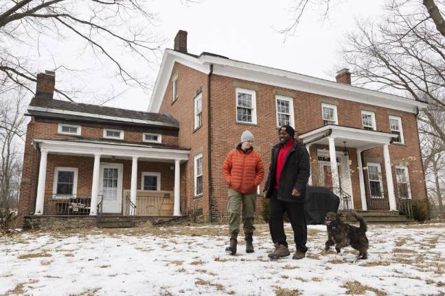 Edgar Hayes and Ann Rader walk the grounds of Freedom Farm Community in Otisville NY on March 1, 2022. ROBERT G BREESE FOR STRAUS NEWS