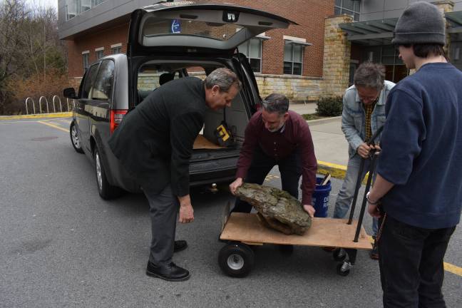 Cracking open deep time Geology Professor Anthony Soricelli unloads the 93-pound “Big One” from Daniel Grant’s Dodge Caravan, to bring up to his classroom in the Science Hall.