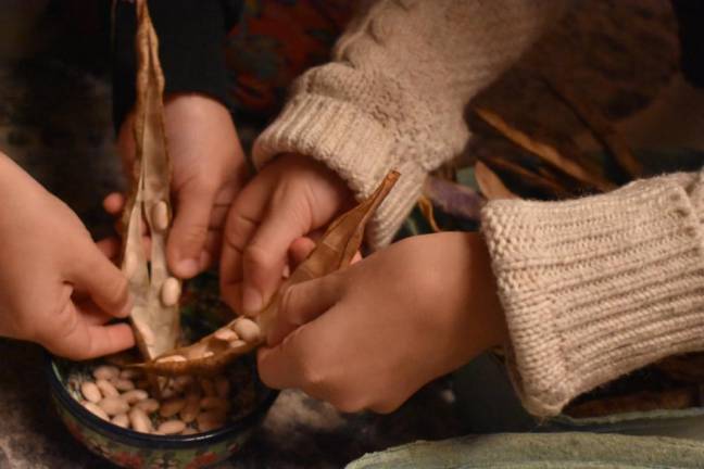 The kids shelling beans while listening to a <i>Harry Potter </i>audiobook, as humans have been doing (minus audiobook) for 8,000 years.