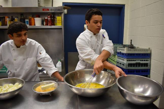 Romin Verez, 16, making breakfast for the class. He does the cooking at home and washes dishes at Glenmere Mansion.