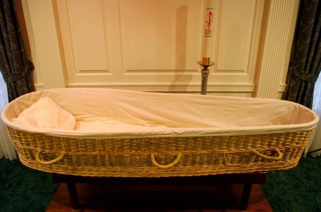 A wicker casket on display at M. John Scanlan Funeral Home in Pompton Plains, NJ, a fourth generation funeral home that offers conventional and green services.