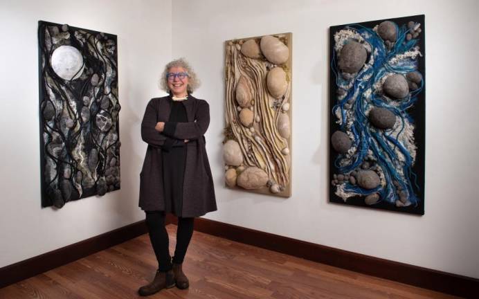 The prolific Muller-McCoola with three ‘sister pieces’ of her felted works.