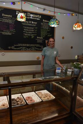 Yvonne Brennan behind the counter at Deez Donutz in Milford, Pa.