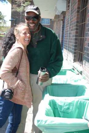 Shabazz Jackson and his wife Josephine Papagni, owners of Greenway Environmental, in front of the compost bins outside the SUNY New Paltz cafeteria.