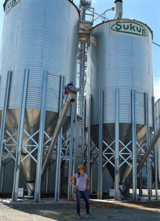 Standing in front of the grain silos.