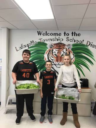 Lafayette students harvested two big trays of lettuce, which were turned into lunch salads, and five pounds of basil.