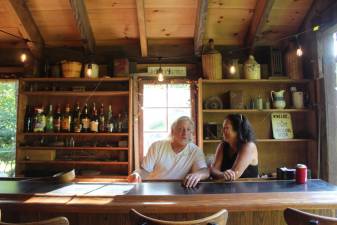 Joe and Val Rinaldi in the “bourbon bar,” a room of the historic DeBaun Mill that they renovated for entertaining guests.
