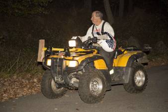 A fireman heading to a staging area on Mt Eve Road after working to extinguish a fire at the top of Mt Eve.