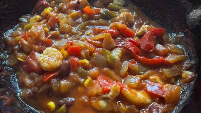 This riff on Cajun cooking skips the slow-cooked beans; instead, spoon it over rice or tear bread alongside.