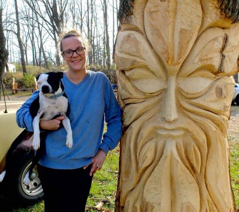 Jennifer Flis, gourd artist and owner of Luft Gardens with tree spirit carving &amp; terrier Pickles.