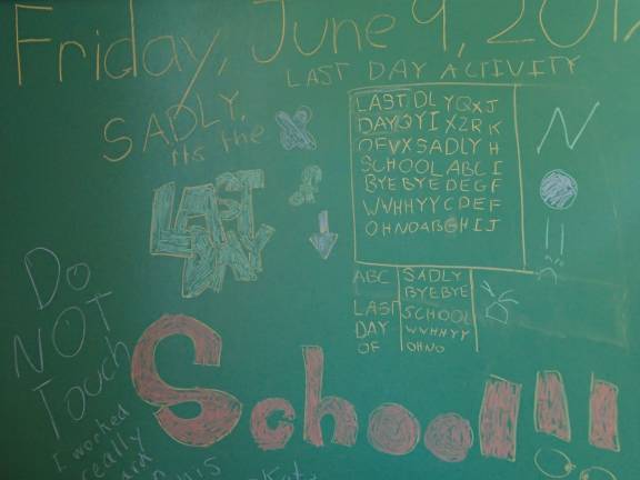 &quot;Sadly, it's the last day of school,&quot; a student wrote on the chalkboard. (This did not appear to be staged!) Photo by Becca Tucker
