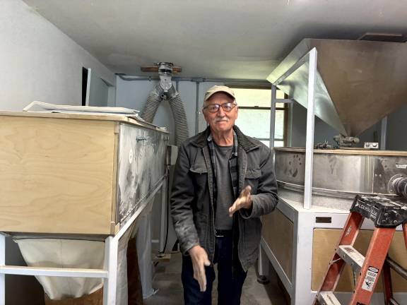 Don Lewis with his New American Stone Mill (at right) at Wild Hive Farm in Dutchess County, NY.