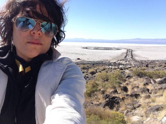 The writer visiting <i>Spiral Jetty </i>(1970) on the shore of the Great Salt Lake in Utah
