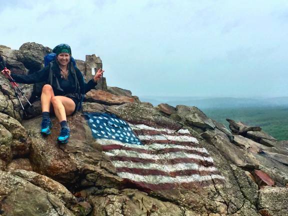 After scaling a massive, “terrifying” wall of rocks in Pennsylvania’s Delaware Water Gap, Heskett found an American flag on the trail.