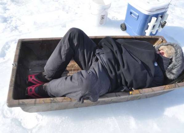 On ice, fishing turns social