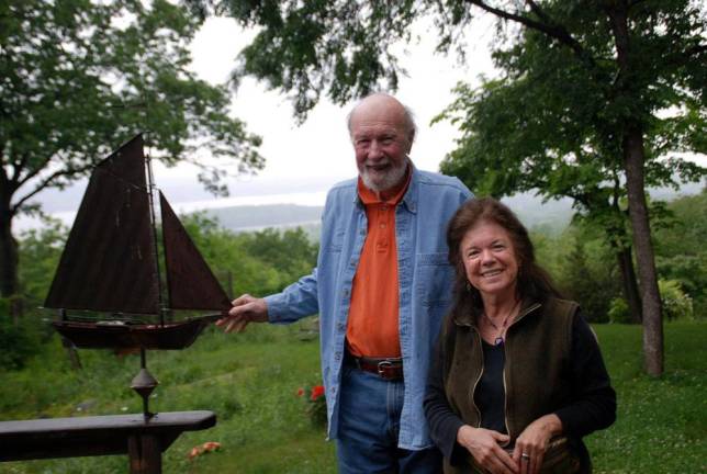 Manna Jo Greene with Pete Seeger and a replica of the Clearwater sloop.