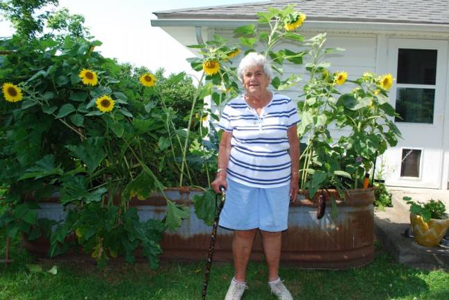 Marion Wright in 2015, as a contestant in <i>Dirt’s</i> Kitchen Garden Tour. Her son converted an old stock tank into a raised bed garden steps from her kitchen door.