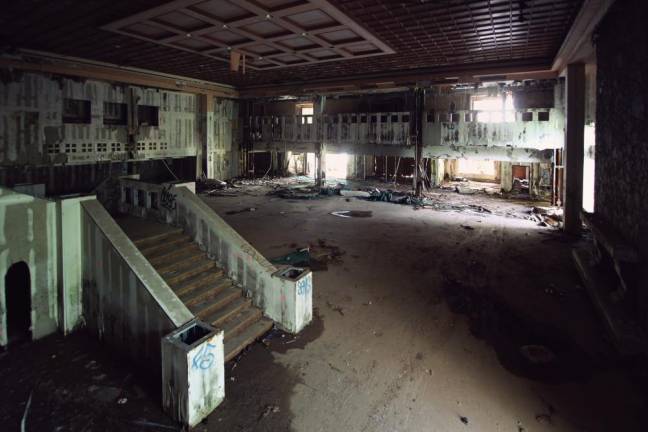 The ruins of the grand lobby, whose woodwork ceiling is now the paneling of the Star Bar and Grill.