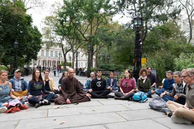 Brother True Dharma Fulfillment leads a sit-in near City Hall