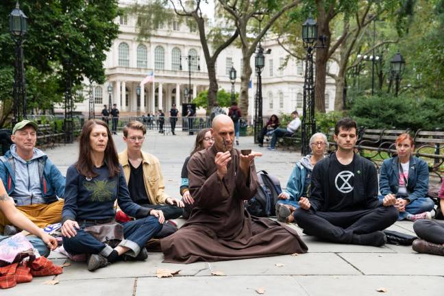 Brother True Dharma Fulfillment leads a sit-in near City Hall