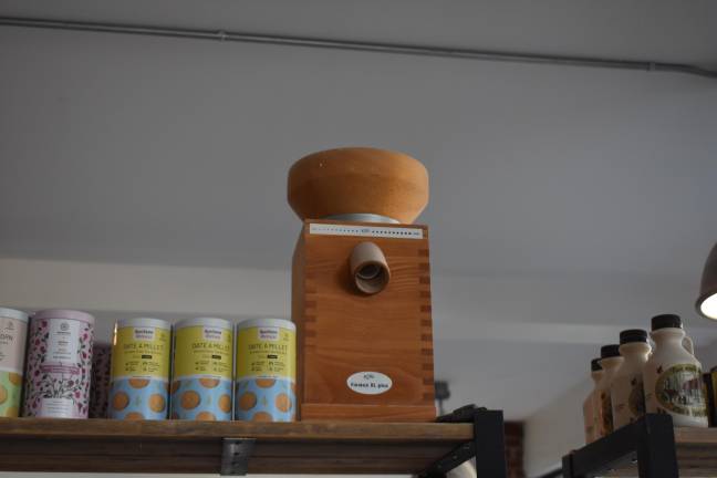 The tabletop mill that River Valley Community Grain used to use is on display in teh store. It looks like a toy in comparison to its new 48-inch state-of-the-art mill.