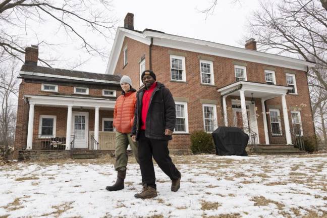 Edgar Hayes and Ann Rader walk the grounds of Freedom Farm Community in Otisville NY on March 1, 2022.