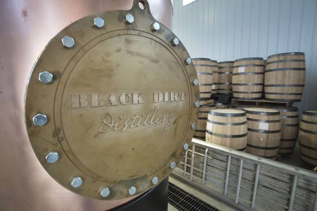 Whiskey barrels stacked at the new Black Dirt Distillery operation in Pine Island on Thursday November 29, 2012